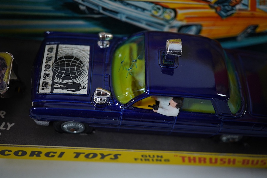 A boxed Corgi Toys (497) Man From Uncle boxed Thrush-Buster, Oldsmobile super 88, together with the Waverly ring, and inner card display stand. Condition - good.